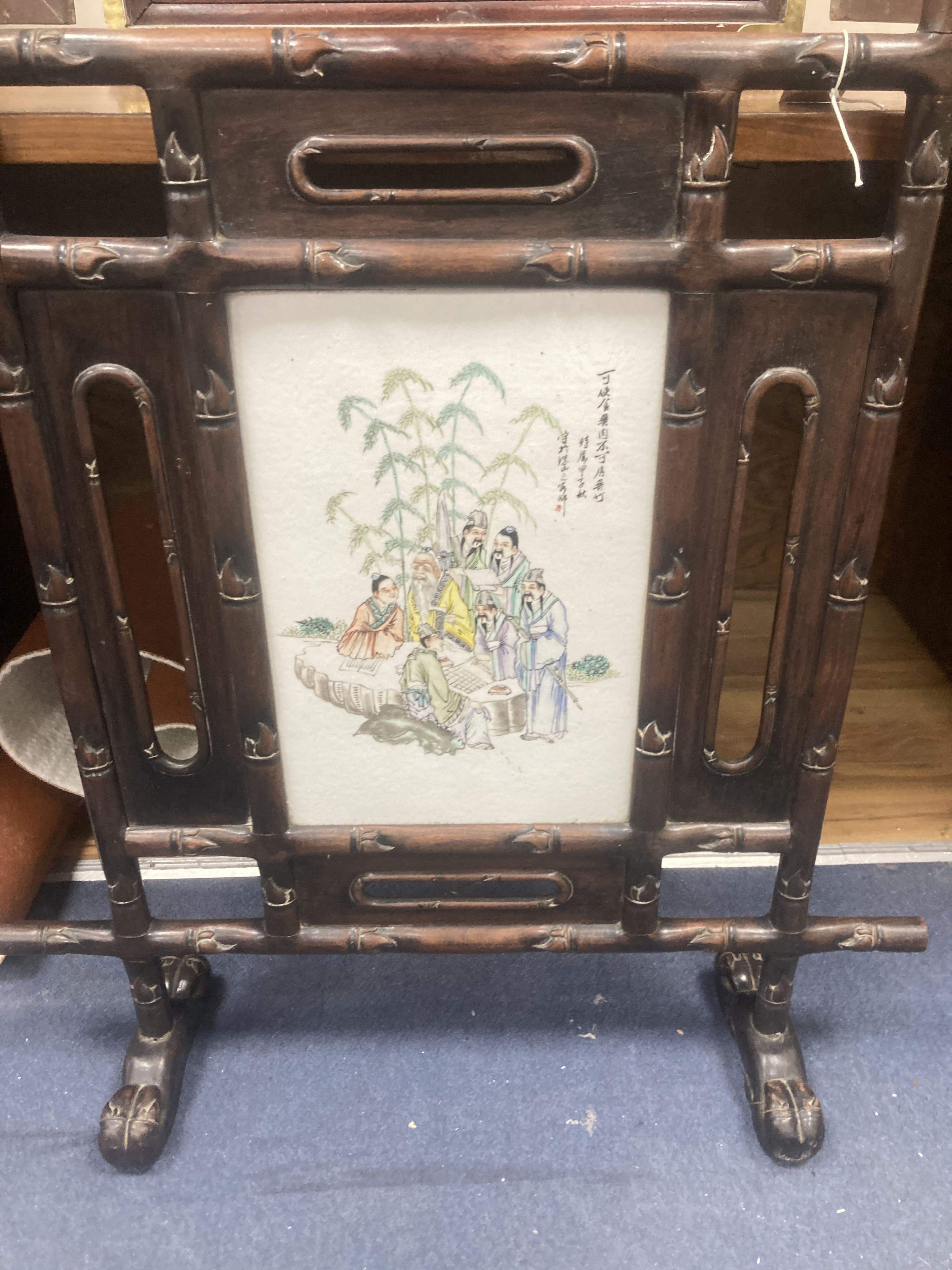 A Chinese hardwood firescreen inset painted porcelain panel W 73 H 86 cms.